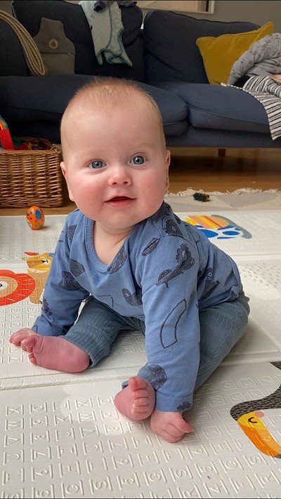 Charlie sitting on mat