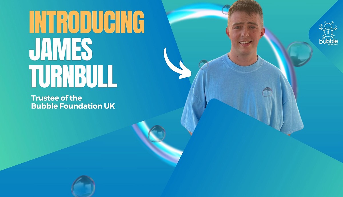 former Bubble patient James as a Trustee of the Bubble Foundation, bubble behind him.